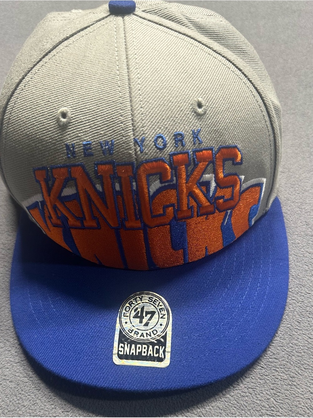 47 Gray and Blue Knicks Snapback with Orange Embroidery